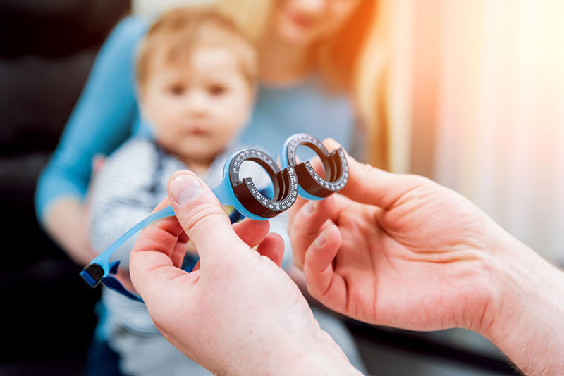 young boy child eye exam